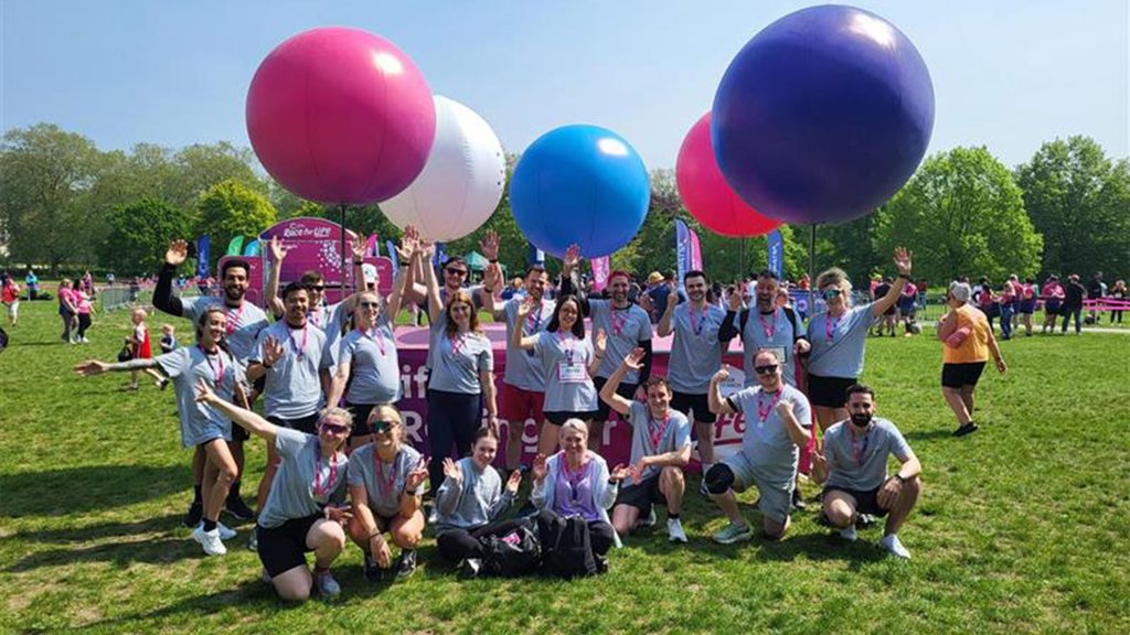 An outdoor group photo of employees that participated in  Race for Life 2024